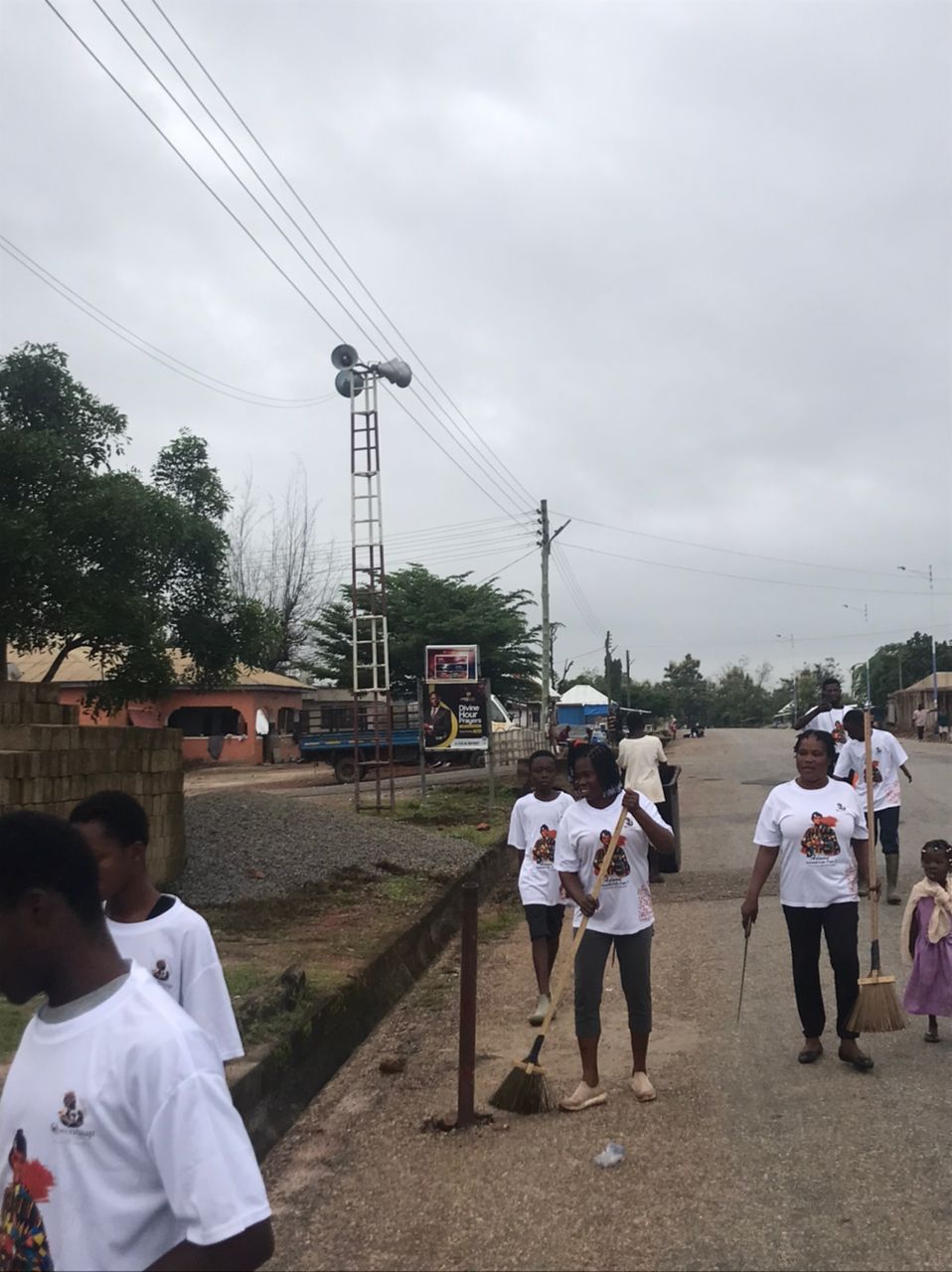 Volunteers digging out clogged drains in Nsuontem